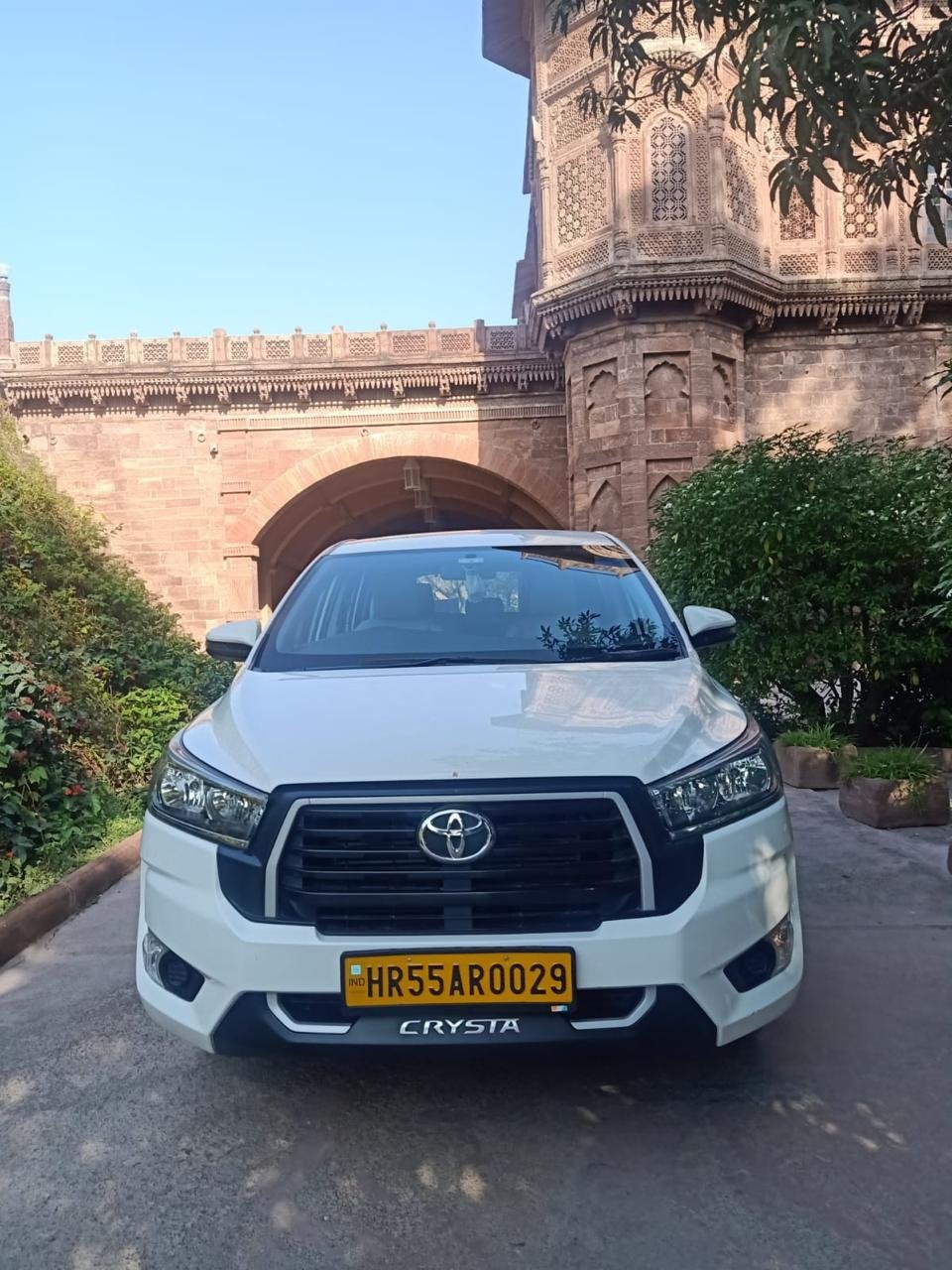 White Toyota Innova Crysta, front view