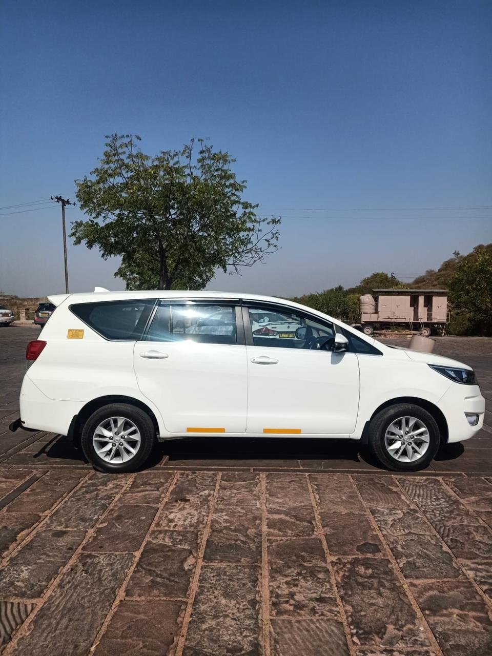 White Toyota Innova Crysta, right-side view