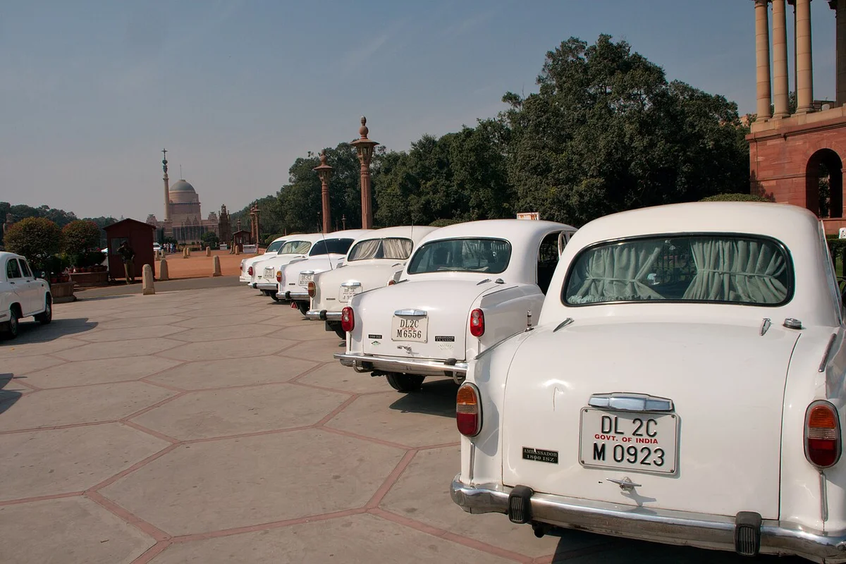 Traditional Uniformed Chauffeur with Heritage Car