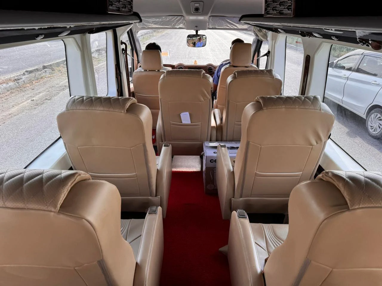 Luxury tan captain seats inside a private Urbania cabin