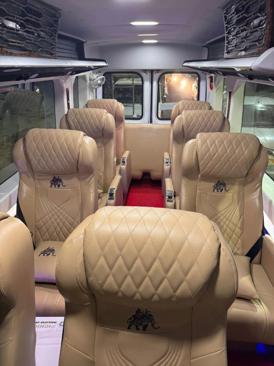 Quilted tan passenger seats inside the Urbania
