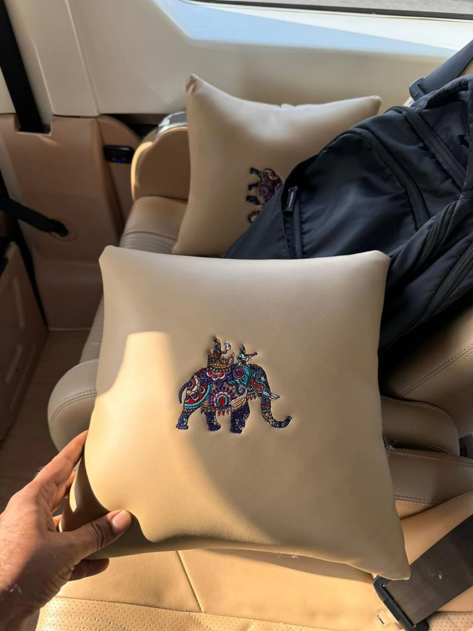 Embroidered cushion on a premium Urbania seat